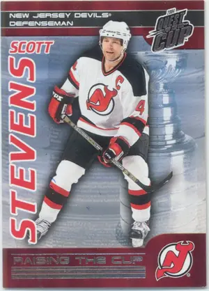 2003-04 QUEST FOR THE CUP - SCOTT STEVENS #13 RAISING THE CUP
